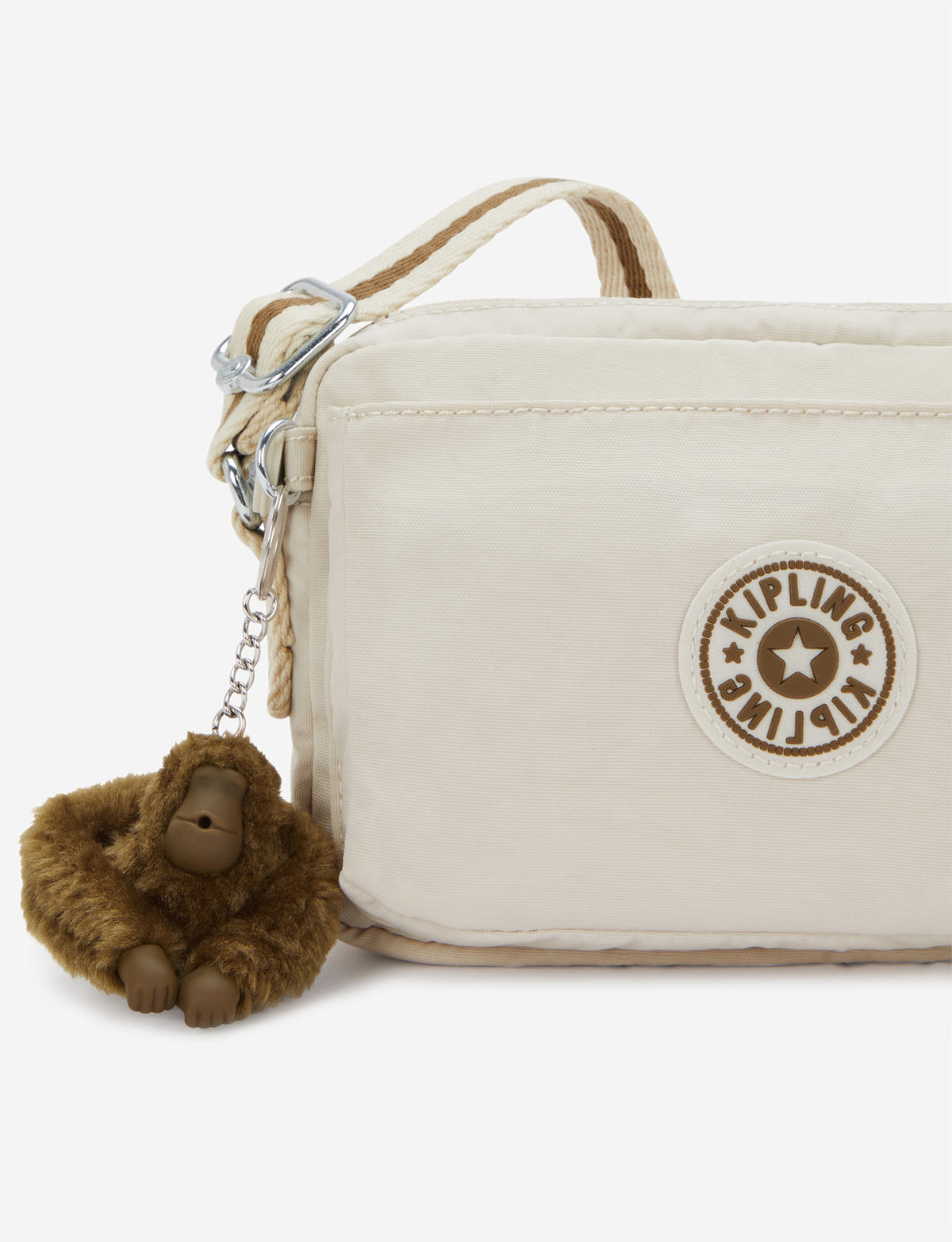 KIPLING حقيبة أبانو كروس بودي صغيرة بلون رملي ناعم I4208-9LO