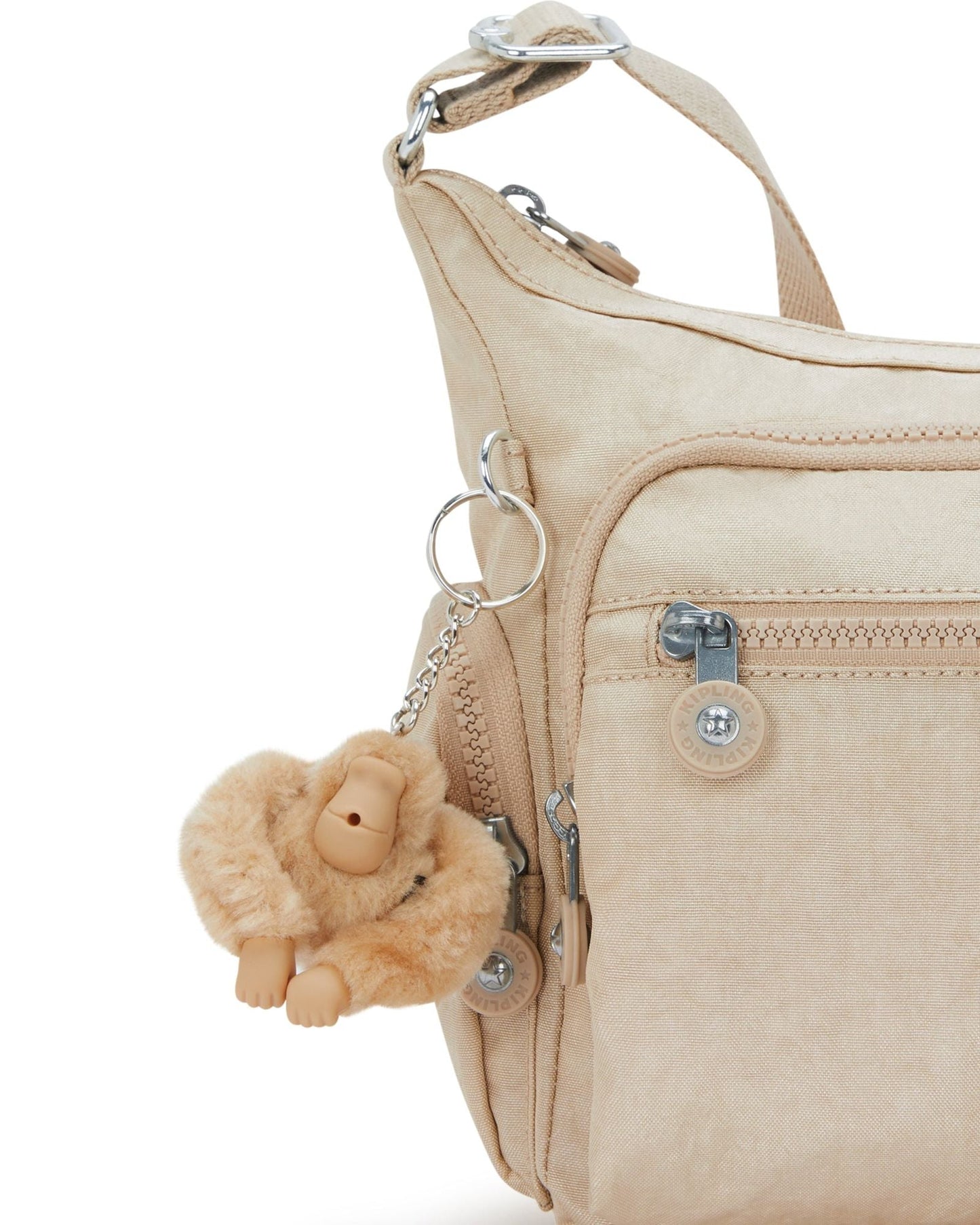 حقيبة كروسبودي متوسطة Kipling Gabbie S لامعة باللون البيج I2532-5DV